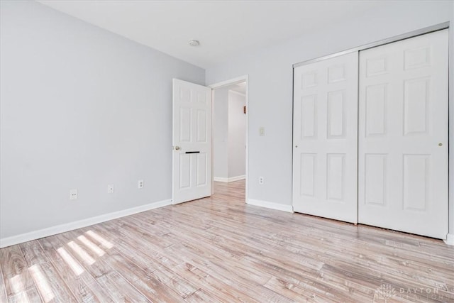 113 Village Trail Dr Unit 6, Vandalia, OH 45377 - unfurnished bedroom with light wood-style floors and a closet