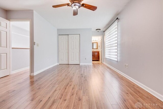 113 Village Trail Dr Unit 6, Vandalia, OH 45377 - unfurnished bedroom with light wood finished floors, a ceiling fan, a closet, and ensuite bathroom