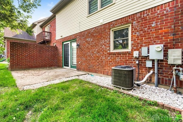113 Village Trail Dr Unit 6, Vandalia, OH 45377 - back of house featuring brick siding, a yard, a patio area, and a balcony