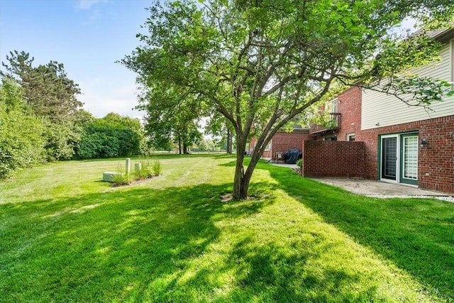 113 Village Trail Dr Unit 6, Vandalia, OH 45377 - view of green lawn with a patio