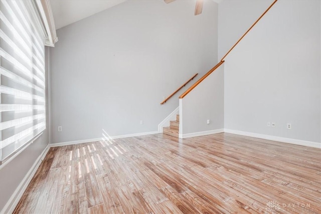 113 Village Trail Dr Unit 6, Vandalia, OH 45377 - unfurnished living room with light wood-style floors, stairs, and ceiling fan