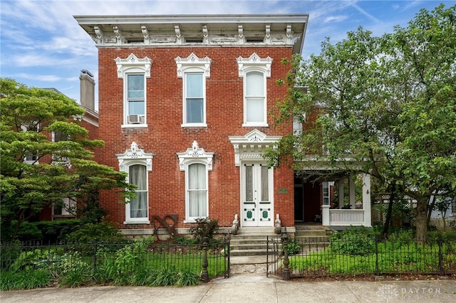 18 E Washington St, Jamestown Vlg, OH 45335 - italianate house with french doors, a fenced front yard, brick siding, and cooling unit