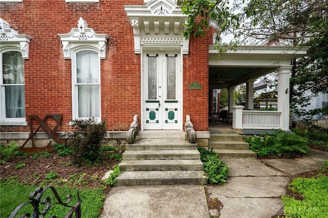 18 E Washington St, Jamestown Vlg, OH 45335 - entrance to property featuring french doors, brick siding, and covered porch
