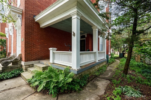 18 E Washington St, Jamestown Vlg, OH 45335 - view of property exterior featuring covered porch and brick siding