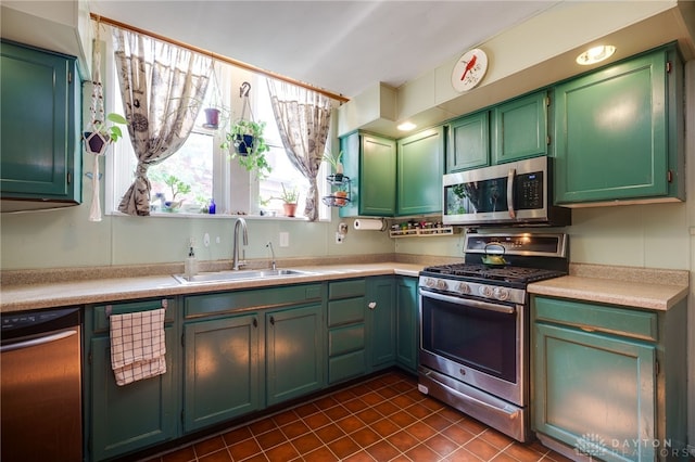 18 E Washington St, Jamestown Vlg, OH 45335 - kitchen with stainless steel appliances, light countertops, and dark tile patterned flooring
