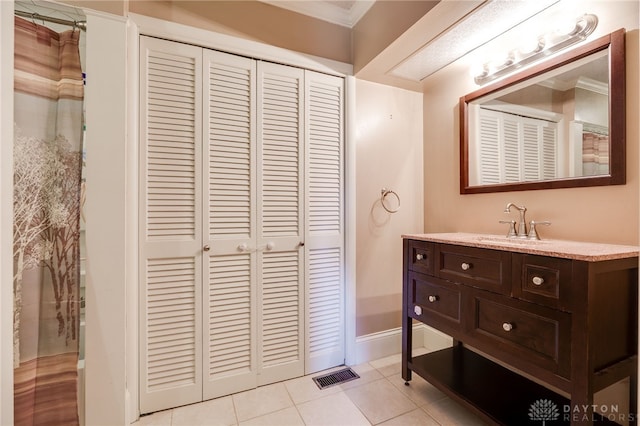 18 E Washington St, Jamestown Vlg, OH 45335 - bathroom featuring a closet, vanity, tile patterned floors, and ornamental molding