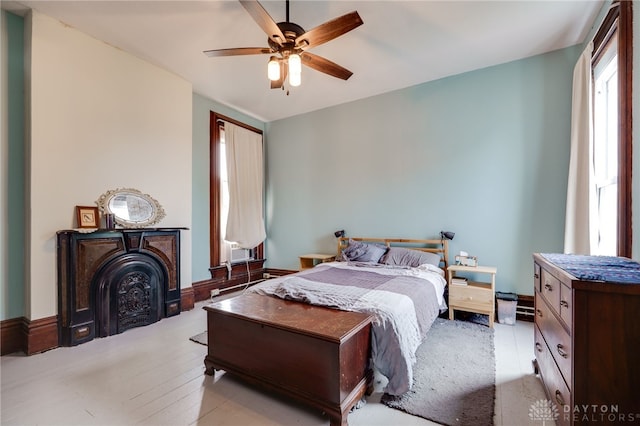 18 E Washington St, Jamestown Vlg, OH 45335 - bedroom featuring a ceiling fan and a fireplace