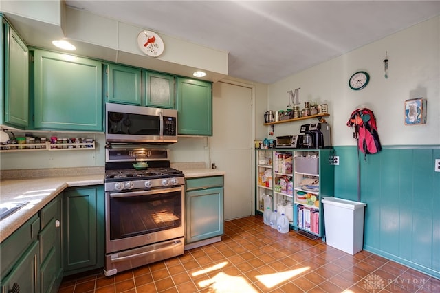 18 E Washington St, Jamestown Vlg, OH 45335 - kitchen with appliances with stainless steel finishes, green cabinets, light countertops, wainscoting, and open shelves