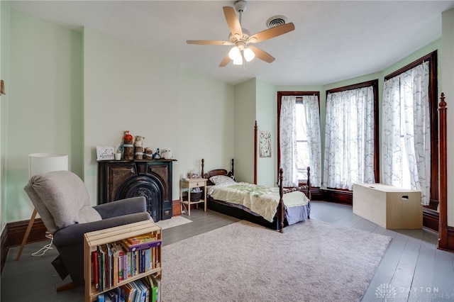 18 E Washington St, Jamestown Vlg, OH 45335 - bedroom with hardwood / wood-style flooring, a fireplace with flush hearth, and a ceiling fan