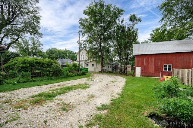 18 E Washington St, Jamestown Vlg, OH 45335 - view of yard featuring driveway and an outbuilding