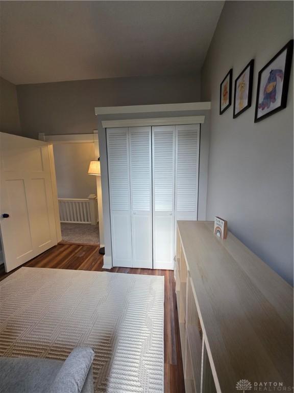126 S Maple St, Eaton, OH 45320 - unfurnished bedroom with dark wood finished floors and a closet