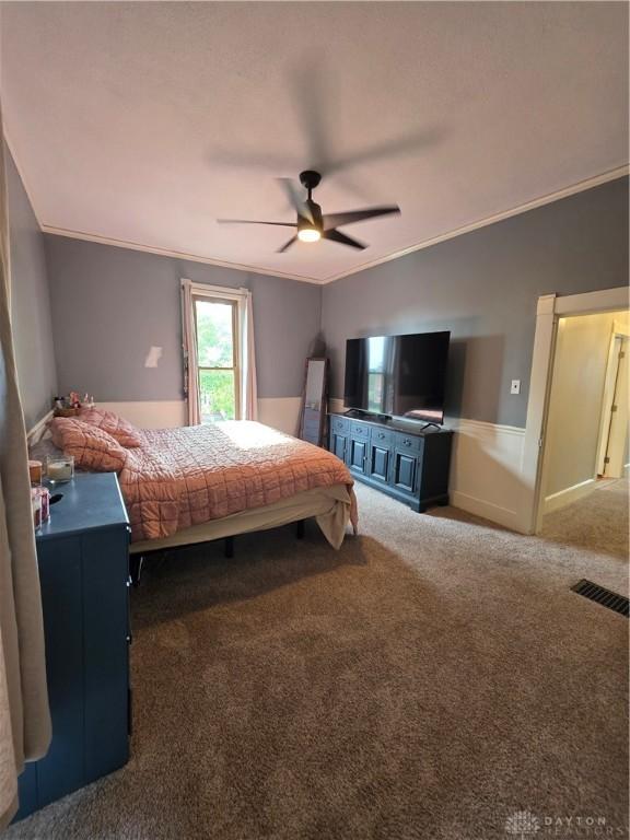 126 S Maple St, Eaton, OH 45320 - carpeted bedroom featuring a ceiling fan and crown molding