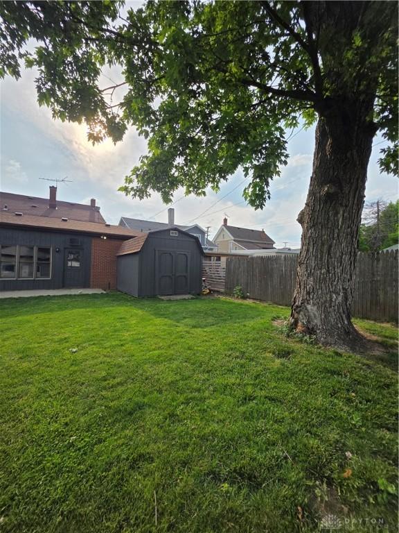 126 S Maple St, Eaton, OH 45320 - fenced backyard featuring a storage shed