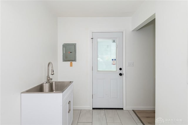 7044 Park Vista Rd, Englewood, OH 45322 - laundry area with electric panel and light tile patterned floors