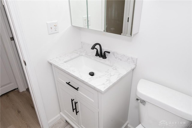 7044 Park Vista Rd, Englewood, OH 45322 - half bath with vanity and wood finished floors