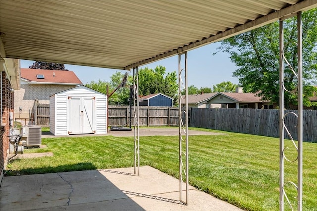 7044 Park Vista Rd, Englewood, OH 45322 - fenced backyard featuring a patio area and a storage unit