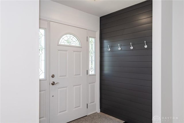 7044 Park Vista Rd, Englewood, OH 45322 - carpeted entryway featuring wood walls