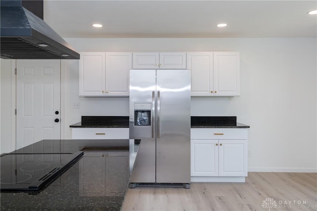 7044 Park Vista Rd, Englewood, OH 45322 - kitchen featuring stainless steel fridge with ice dispenser, exhaust hood, stovetop with downdraft, light wood-style floors, and recessed lighting