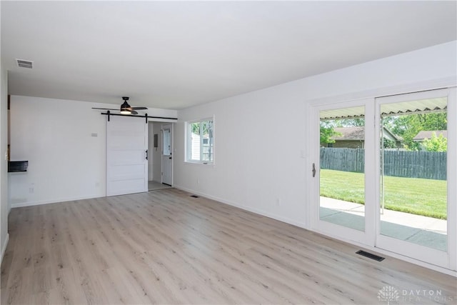 7044 Park Vista Rd, Englewood, OH 45322 - unfurnished living room featuring a ceiling fan and light wood finished floors