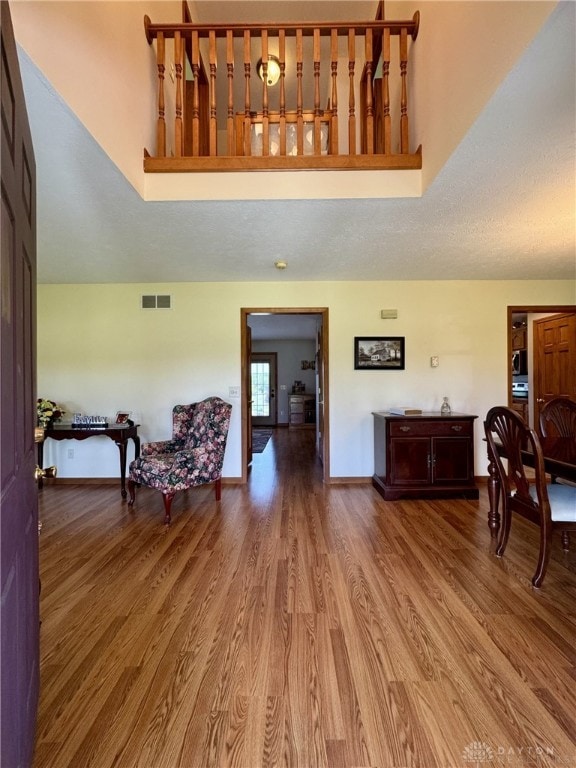 2950 S Clayton Rd, Farmersville, OH 45325 - interior space featuring wood finished floors and a towering ceiling