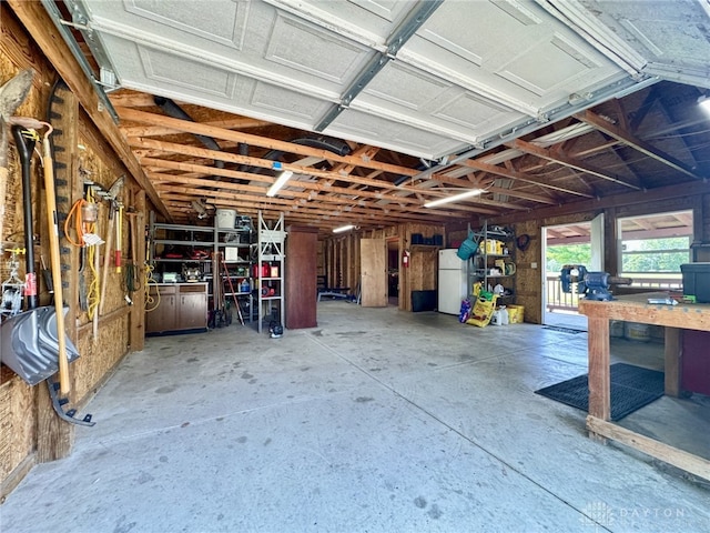 2950 S Clayton Rd, Farmersville, OH 45325 - garage with freestanding refrigerator