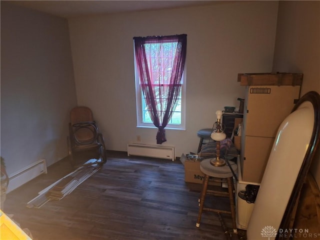 291 Chamberlin Rd, Carlisle, OH 45005 - misc room featuring baseboard heating, a baseboard radiator, and wood finished floors