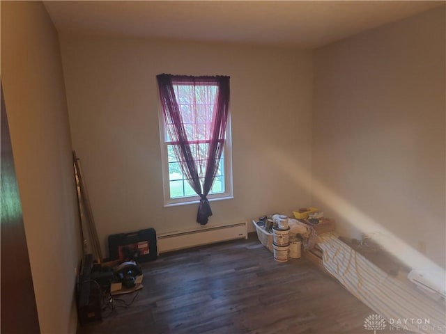 291 Chamberlin Rd, Carlisle, OH 45005 - unfurnished room with a baseboard heating unit and wood finished floors