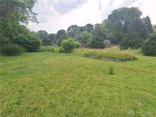 291 Chamberlin Rd, Carlisle, OH 45005 - view of green lawn with an outbuilding