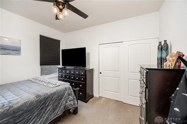 5078 Magellan Way, Franklin, OH 45005 - bedroom with light colored carpet, a closet, and ceiling fan