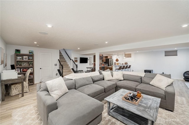 5078 Magellan Way, Franklin, OH 45005 - living area with light wood-style flooring, stairs, recessed lighting, and bar