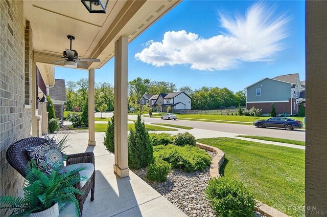 5078 Magellan Way, Franklin, OH 45005 - covered porch featuring ceiling fan, a yard, and a residential view
