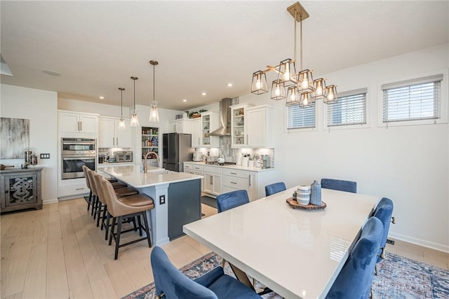 5078 Magellan Way, Franklin, OH 45005 - dining area featuring recessed lighting, light wood-type flooring, and a chandelier