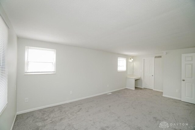 2949 N Bend Rd, Cincinnati, OH 45239 - basement with carpet floors and baseboards