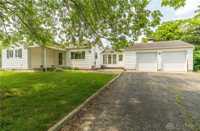 235 Stonequarry Rd, Vandalia, OH 45377 - view of front facade featuring driveway, a front lawn, an attached garage, and a chimney