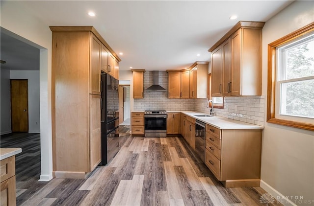 235 Stonequarry Rd, Vandalia, OH 45377 - kitchen featuring appliances with stainless steel finishes, wall chimney exhaust hood, tasteful backsplash, light countertops, and recessed lighting