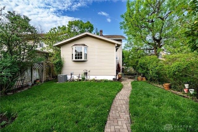 301 E Peach Orchard Ave, Oakwood, OH 45419 - back of property featuring a chimney