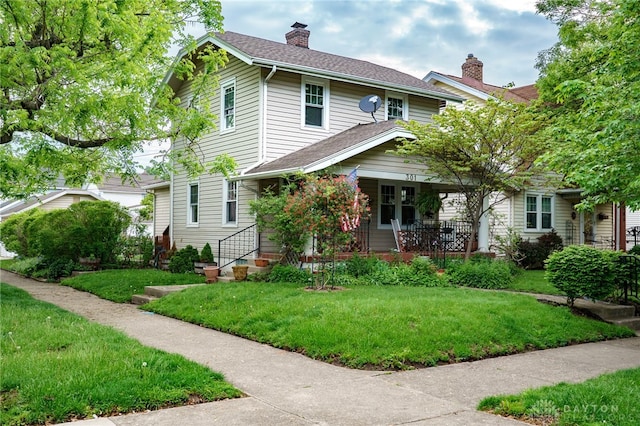 301 E Peach Orchard Ave, Oakwood, OH 45419 - view of front facade featuring covered porch, a front lawn, a chimney, and a shingled roof