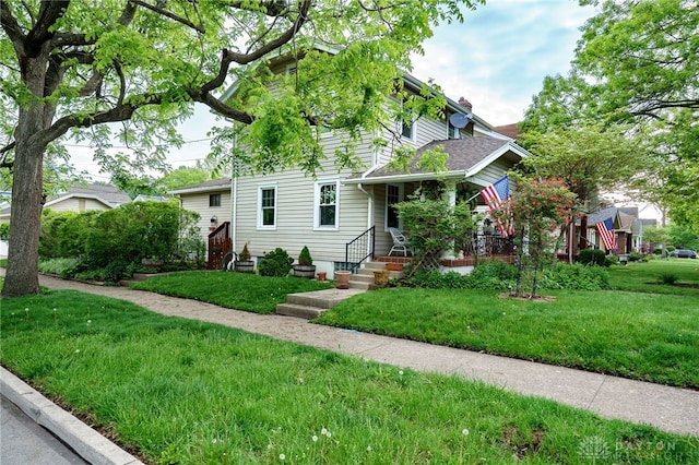 301 E Peach Orchard Ave, Oakwood, OH 45419 - view of property hidden behind natural elements featuring a front lawn