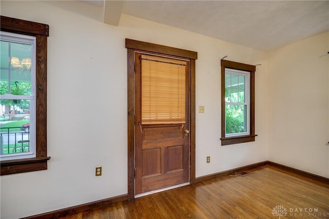 301 E Peach Orchard Ave, Oakwood, OH 45419 - spare room featuring healthy amount of natural light and dark wood-style floors
