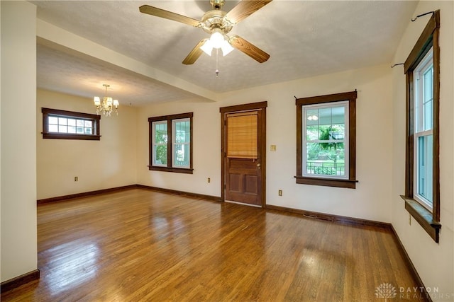 301 E Peach Orchard Ave, Oakwood, OH 45419 - spare room with wood finished floors, a chandelier, and a ceiling fan