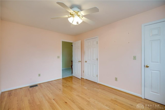 301 E Peach Orchard Ave, Oakwood, OH 45419 - unfurnished bedroom featuring light wood-style flooring and a ceiling fan