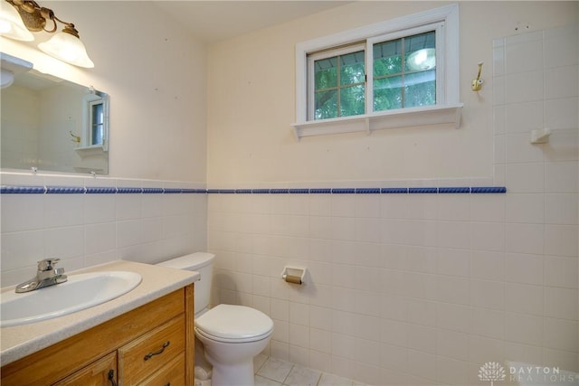 301 E Peach Orchard Ave, Oakwood, OH 45419 - half bath with tile walls, vanity, and tile patterned floors