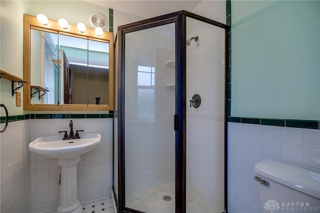 301 E Peach Orchard Ave, Oakwood, OH 45419 - full bathroom with tile walls, a shower stall, and wainscoting