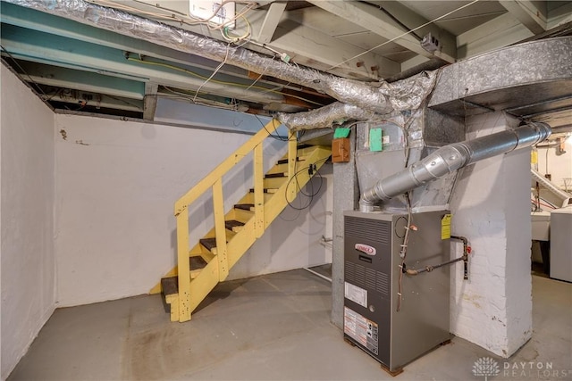 301 E Peach Orchard Ave, Oakwood, OH 45419 - unfinished below grade area featuring heating unit, stairs, and washer / clothes dryer