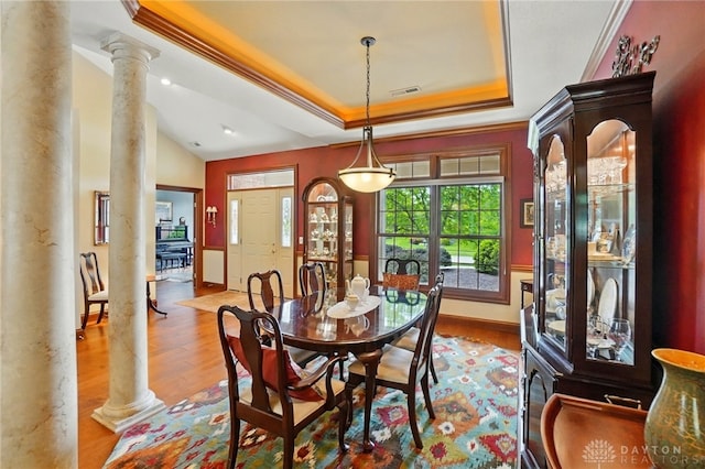 1106 Roger Scott Dr, Bellbrook, OH 45305 - dining room featuring ornate columns, a raised ceiling, wood finished floors, ornamental molding, and recessed lighting