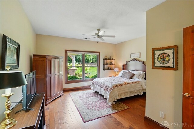 1106 Roger Scott Dr, Bellbrook, OH 45305 - bedroom with light wood-style flooring and a ceiling fan