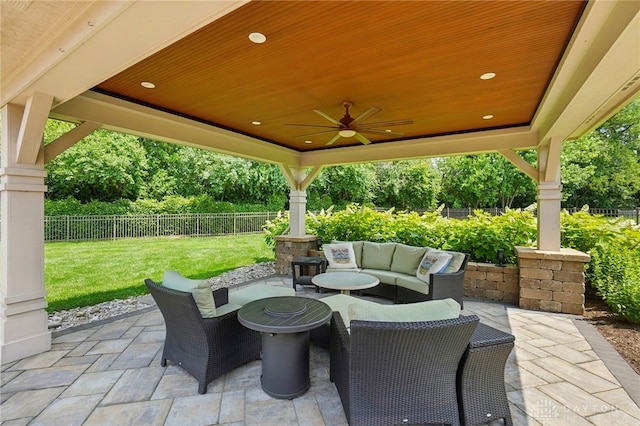 1106 Roger Scott Dr, Bellbrook, OH 45305 - fenced backyard with a patio area, a ceiling fan, and outdoor lounge area