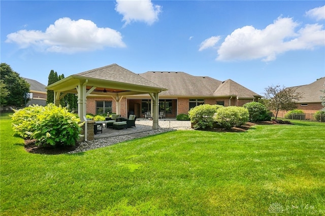 1106 Roger Scott Dr, Bellbrook, OH 45305 - rear view of house featuring a ceiling fan, brick siding, a patio area, and an outdoor hangout area