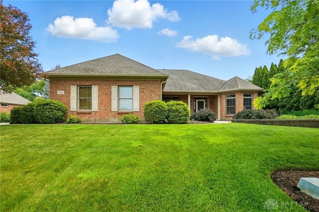 1106 Roger Scott Dr, Bellbrook, OH 45305 - view of front of property featuring a front yard, brick siding, and a shingled roof