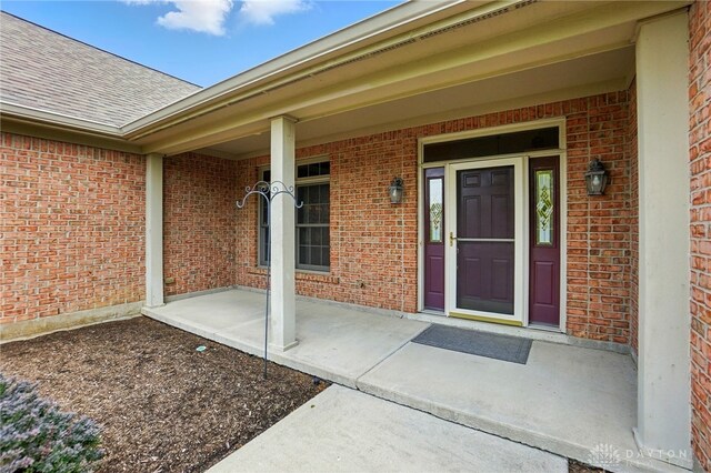 1106 Roger Scott Dr, Bellbrook, OH 45305 - entrance to property with brick siding, roof with shingles, and a porch